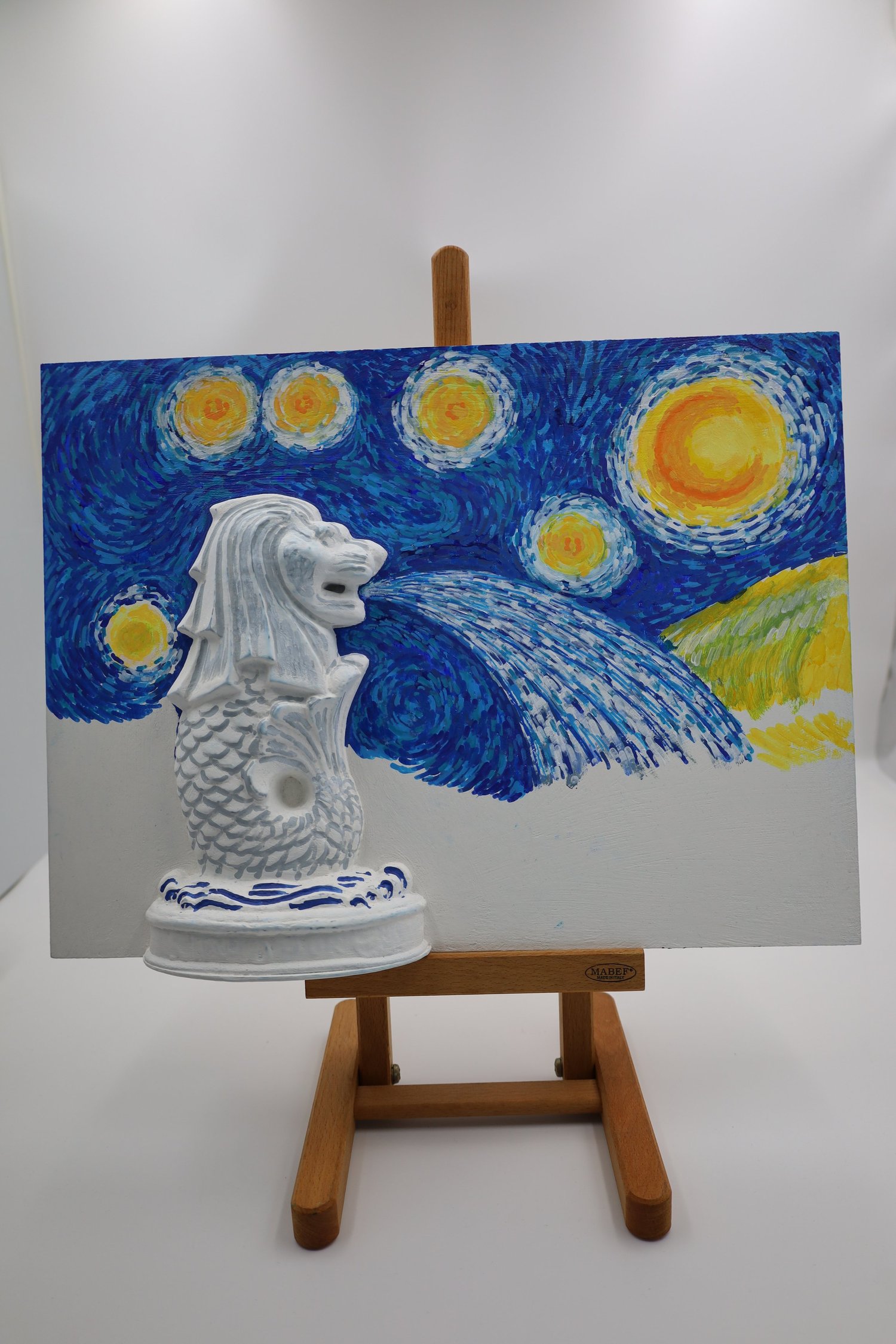 A 3D-printed Merlion mounted on a Starry Night style canvas, painted at a COLORVERSE art jamming session